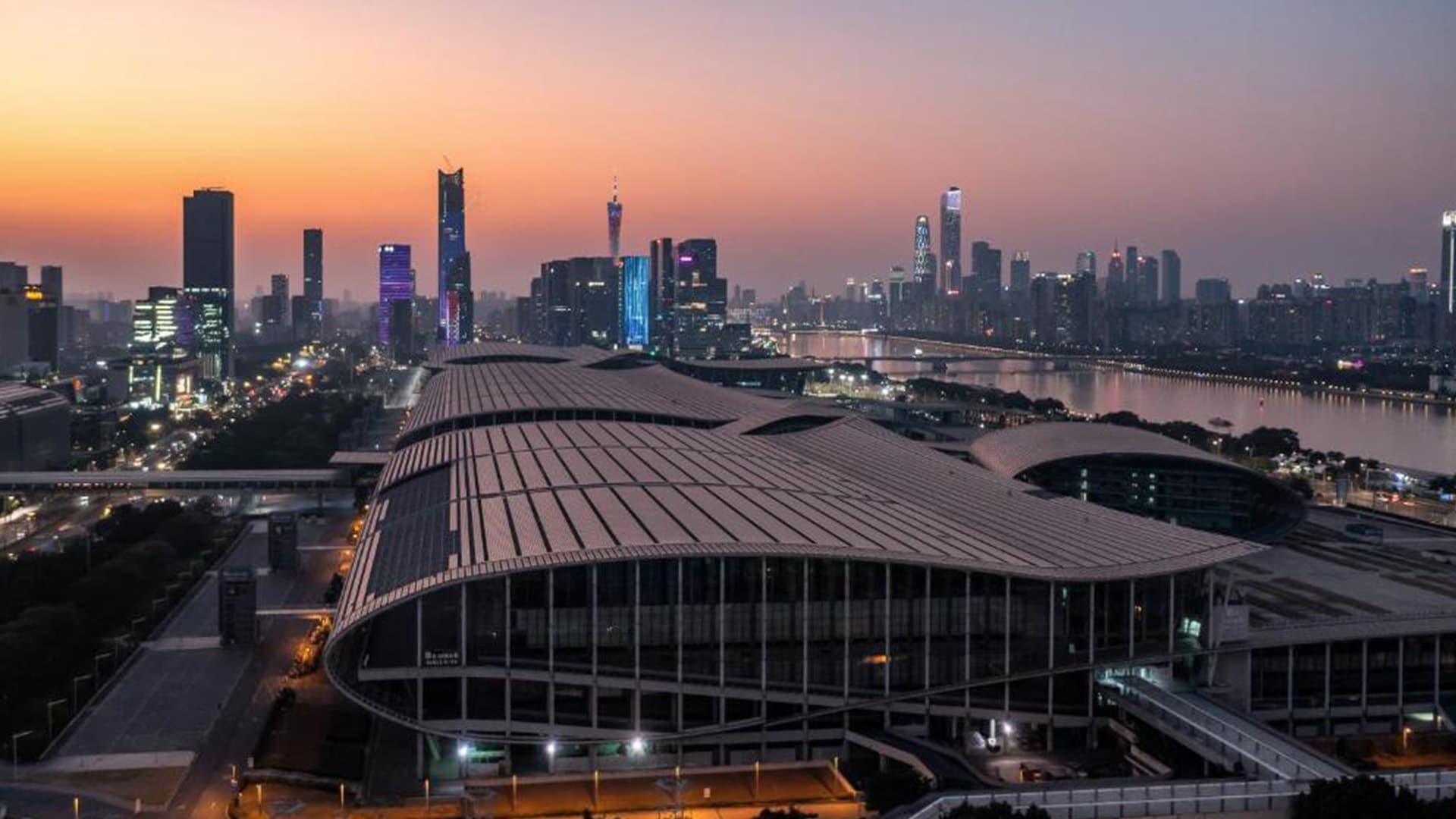 Guangzhou skyline at dusk beside the China Import and Export Fair Complex, on the Pearl River